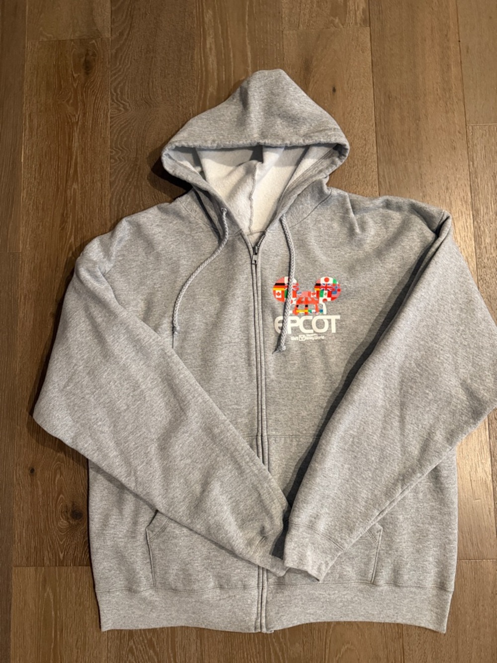 Disneyworld Epcot Unisex grey zip up sweatshirt. Size:XL. Gently Used.